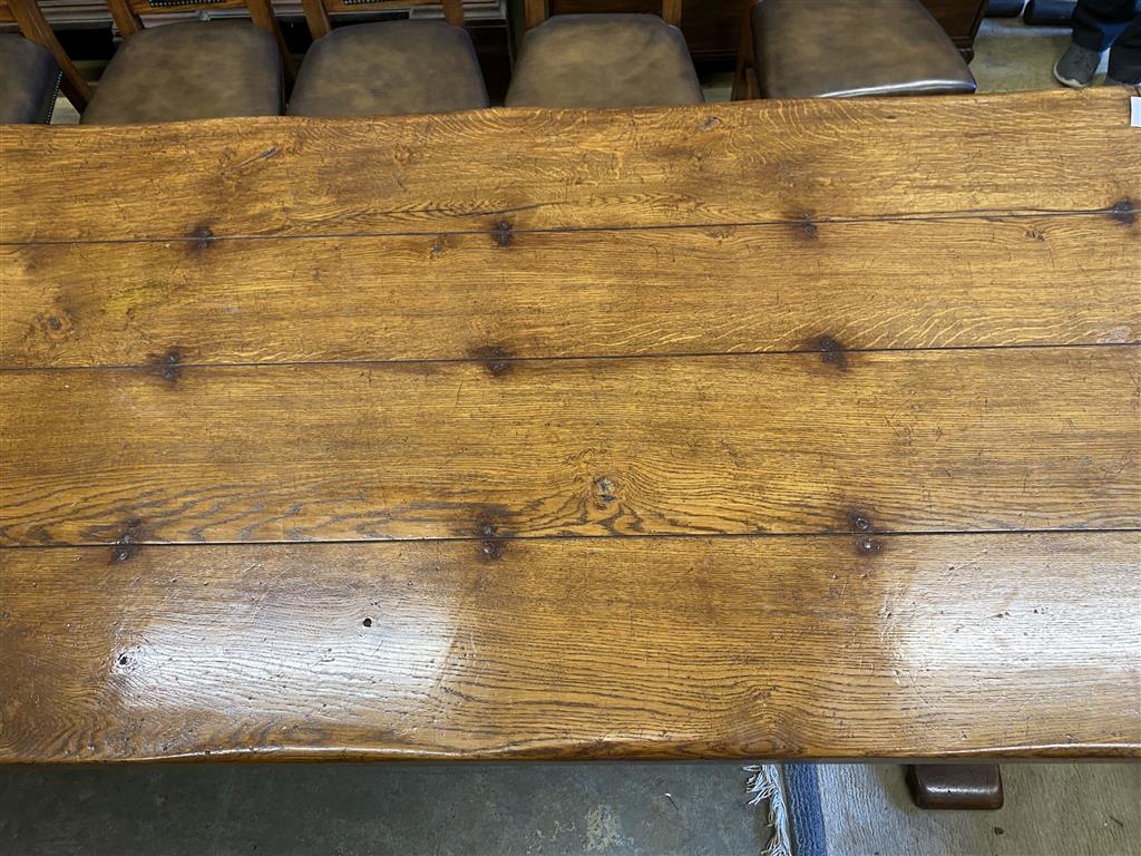 An 18th century style rectangular oak refectory dining table, length 274cm, depth 106cm, height 76cm